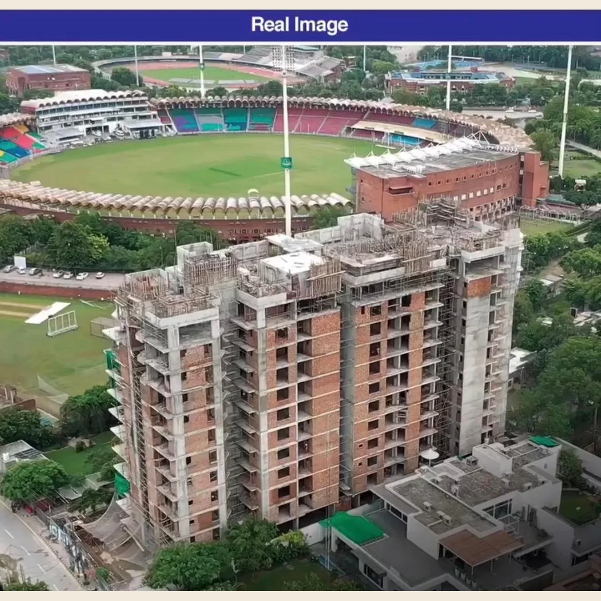 Home Real photo of The Springs Gaddafi building under construction beside the stadium